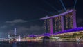 Beautiful laser and musical fountain show at the Marina Bay Sands waterfront in Singapore night timelapse Royalty Free Stock Photo