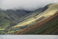 Beautiful late Summer landscape image of Wasdale Valley in Lake District, looking towards Scafell Pike, Great Gable and Kirk Fell