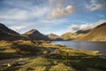 Beautiful late Summer landscape image of Wasdale Valley in Lake District, looking towards Scafell Pike, Great Gable and Kirk Fell Royalty Free Stock Photo
