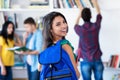 Beautiful latin american female student with group of students Royalty Free Stock Photo