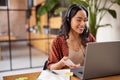 Beautiful latin businesswoman working on laptop during video call Royalty Free Stock Photo