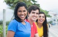 Beautiful latin woman in a blue shirt with caucasian man and native friend Royalty Free Stock Photo