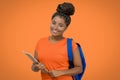 Beautiful laughing african american female student with backpack and paperwork Royalty Free Stock Photo