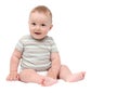 Beautiful laughing baby boy sitting on white