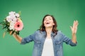 Beautiful laughing woman holding flower bouquet isolated