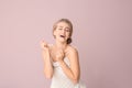 Beautiful laughing woman with nude makeup on color background Royalty Free Stock Photo