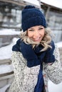 Beautiful laughing woman with a perfect smile. Happy sincere winter outdoor portrait of attractive model in winter clothes Royalty Free Stock Photo