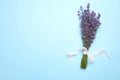 Beautiful lavender bouquet on blue background, top view. Space for text Royalty Free Stock Photo