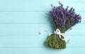 Beautiful lavender bouquet on blue wooden background, top view. Space for text Royalty Free Stock Photo