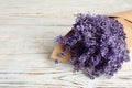 Beautiful lavender bouquet on wooden table, closeup. Space for text Royalty Free Stock Photo