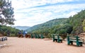 A beautiful lawn with park bench to sit and rest alone on a paved walk with lush greenery surrounded by Satpura and Vindhya