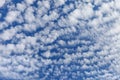 Beautiful layered cumulus clouds on a blue sky background. Stratocumulus clouds