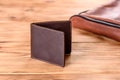 Beautiful leather brown purse made of leather to store paper money Royalty Free Stock Photo