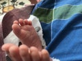 Beautiful Legs of an Infant closeup image and parents are happy for the new born baby with healthy and make everyone happy in the