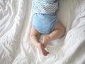 Beautiful legs of a 6-month-old child in blue panties Royalty Free Stock Photo