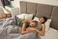 Beautiful lesbian girls sleeping on bed at home