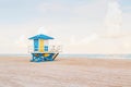 Beautiful light airy tropical Florida landscape with blue yellow lifeguard house. American Florida beach ocean view with lifeguard Royalty Free Stock Photo
