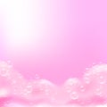 Beautiful light background with Bath pink foam and empty place for your text. Shampoo bubbles texture. Sparkling pink