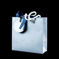 Beautiful light blue gift bag. Close up. Isolated on black background Royalty Free Stock Photo