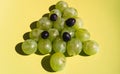 A beautiful, light and delicious Christmas snack for the whole family. Idea for a treat for a new year`s buffet. Green grape Royalty Free Stock Photo