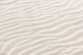 Beautiful light sand texture. Wave texture on the sand. Sandy beach for a background. Top view Royalty Free Stock Photo