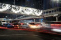 Beautiful light trails with modern pedestrian bridge Royalty Free Stock Photo