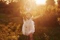 Beautiful lightbeam. Mother with boy and girl spending free time on the field at sunny day time of summer