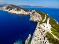 Beautiful lighthouse building at the end of a vertical cliff in Lefkada, Popular tourist destination in Grece