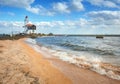 Beautiful lighthouse on the sea coast at sunset Royalty Free Stock Photo