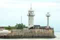 A beautiful lighthouse stands on the shore