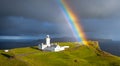 beautiful lighthouse on top of a mountain with a large meadow Royalty Free Stock Photo