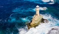 The beautiful Lighthouse Tourlitis of Chora at night. Andros island, Cyclades, Greece