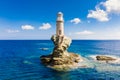 The beautiful Lighthouse Tourlitis of Chora at night. Andros island, Cyclades, Greece