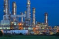 Beautiful lighting of oil refinery palnt against dusky blue sky Royalty Free Stock Photo