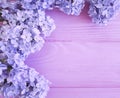 Beautiful lilac on pink wooden summer arrangement Royalty Free Stock Photo