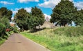 Beautiful Limburg countryside landscape, empty road to rural village and medieval church - Venlo (Hout Blerick) Royalty Free Stock Photo