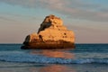 Beautiful limestone rock colored in red by sunset light. Portimao, Portugal