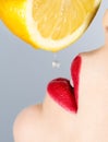 Beautiful lips and falling drop of lemon Royalty Free Stock Photo
