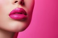 beautiful lips with pink lipstick on a pink background
