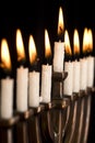 Beautiful lit hanukkah menorah on black. Royalty Free Stock Photo