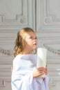 Beautiful little angel with candle praying Royalty Free Stock Photo