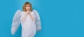 Beautiful little angel. Isolated studio shot. Cute Pretty child with angel wings. Banner for header design, flyer