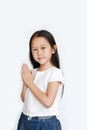 Beautiful little Asian child girl praying isolated on white background Sawasdee is meaning hello Royalty Free Stock Photo