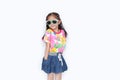 Beautiful little Asian kid girl wearing a flowers summer dress and sunglasses isolated on white background looking camera. Summer Royalty Free Stock Photo