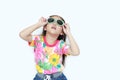 Beautiful little Asian kid girl wearing a flowers summer dress and sunglasses looking up  on white background. Summer and Royalty Free Stock Photo