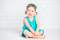 Beautiful little baby girl in a turquoise dress Royalty Free Stock Photo