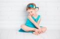 Beautiful little baby girl in a turquoise dress Royalty Free Stock Photo