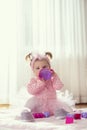 Baby girl drinking water from a bottle Royalty Free Stock Photo