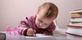 Beautiful little baby girl is writing letter Royalty Free Stock Photo