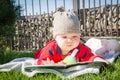 Beautiful little baby is reading a book